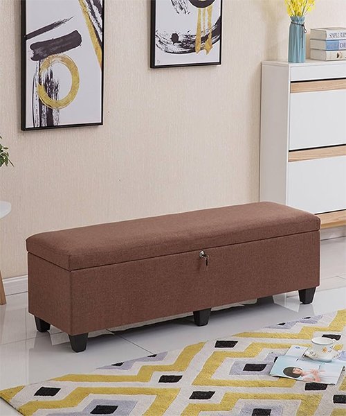 A storage bench (or a small ottoman with hidden space)